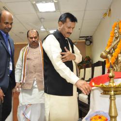 Prof Biharilal Sharma Lighting the lamp